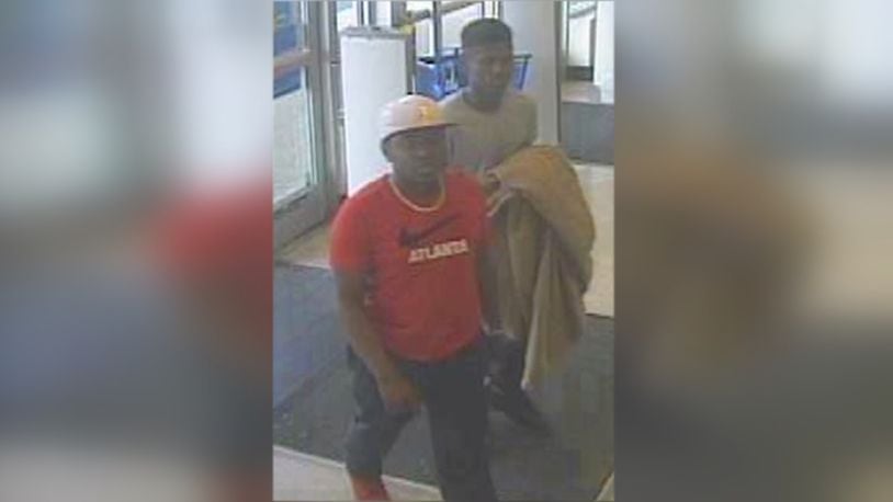 Two men seen on video attacking woman inside Ross clothing store. (Gwinnett County Police Department)