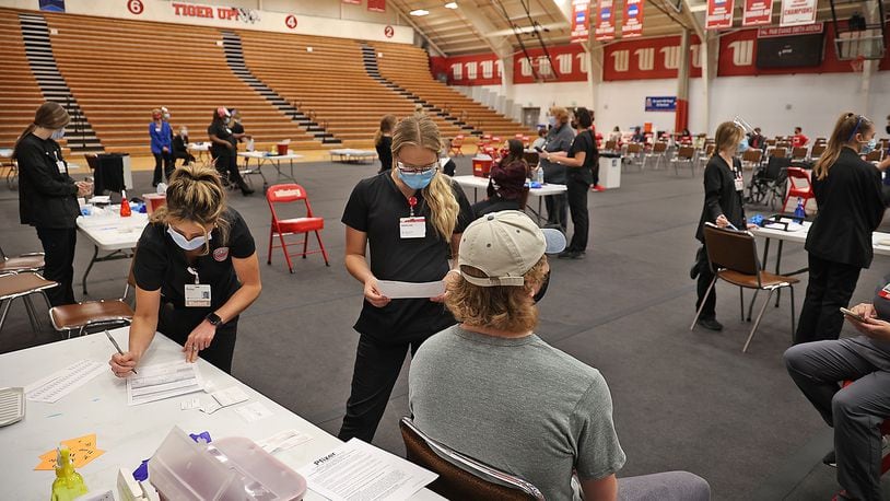 A COVID vaccination clinic is set up in the Pam Evans Smith Arena at Wittenberg University to vaccinate the Wittenberg students. BILL LACKEY/STAFF