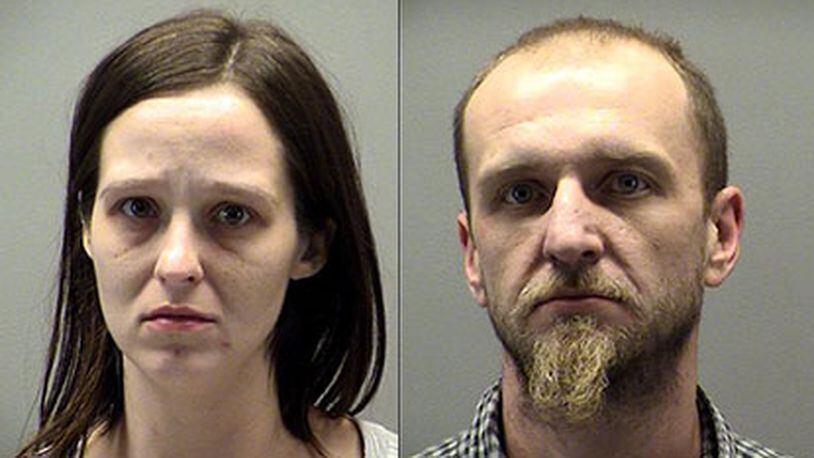 Jeanette and Bobby Dale Davis were taken into police custody on drug and child endangerment charges after Dayton police officers located heroin and an infant in their van.