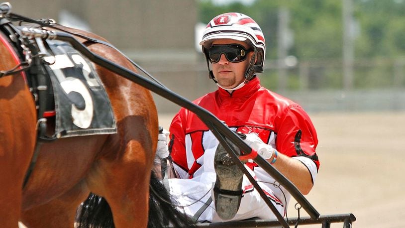 Kayne Kauffman, pictured driving, was knocked from a sulky cart during at Miami Valley Gaming. The horse he was driving, He’s a Perfect 10, drowned in a pond in the track infield. Contributed photo/Brad Conrad