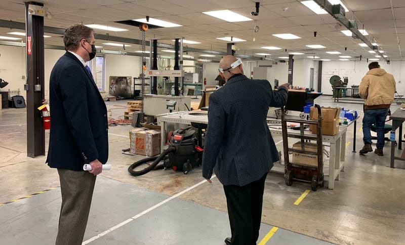 U.S. Rep. Mike Turner, left, with Ayman Salem, chief executive of Material Resources, a Beavercreek defense contractor. Turner visited the company's labs and offices Tuesday. Photo from Turner's staff.