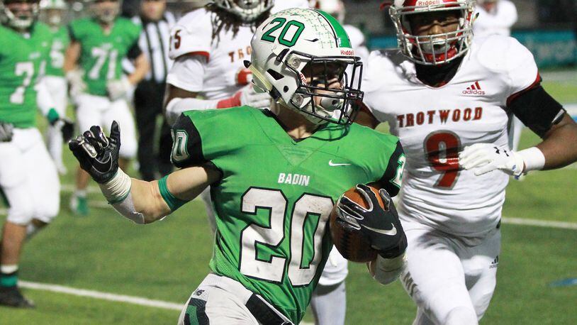 Alex DeLong of Badin (20) turns the corner on Daylen Morgan of Trotwood (9). DeLong was named first team All-Ohio D-III. MARC PENDLETON / STAFF