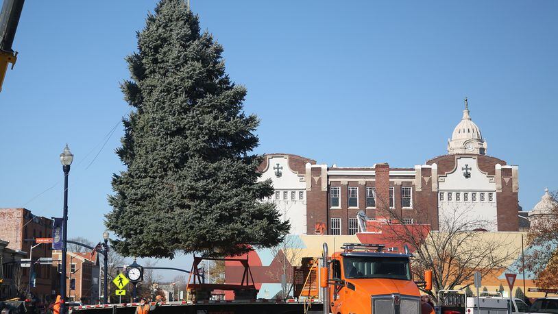 The Christmas tree for Troy's Public Square was delivered Thursday, Nov. 12. The city's Holiday Lighting 2020 event kicks off at 6:30 p.m. Friday, Nov. 27. There will be Christmas music, the arrival of Santa on a fire truck and the annual lighting of the tree and levee lights. Facial coverings and social distancing are encouraged and commemorative masks will be available. LISA POWELL / STAFF