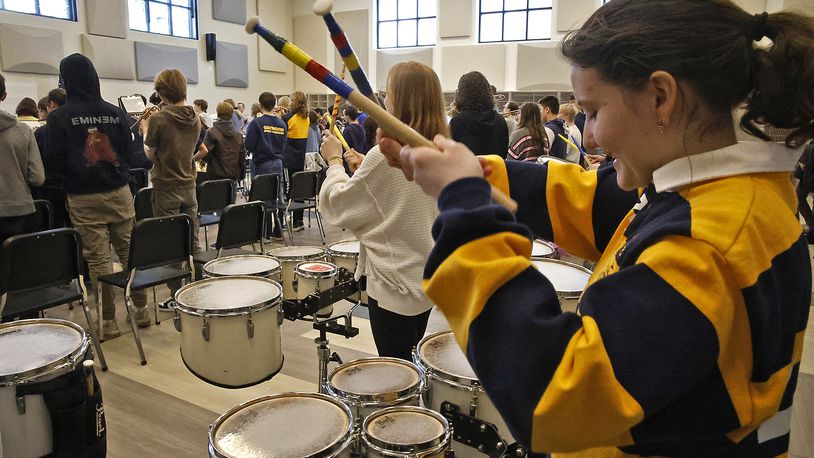 The Oakwood marching band plays as guests tour the new Rick and Jane Schwartz Performing Arts Wing, which was unveiled Wednesday. BILL LACKEY/STAFF