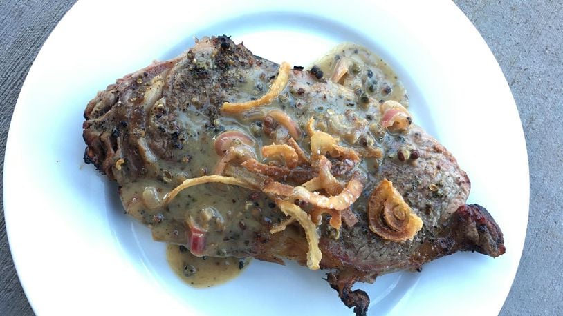 Grilled rib-eye steak with onion straws. (Lee Svitak Dean/Minneapolis Star Tribune/TNS)