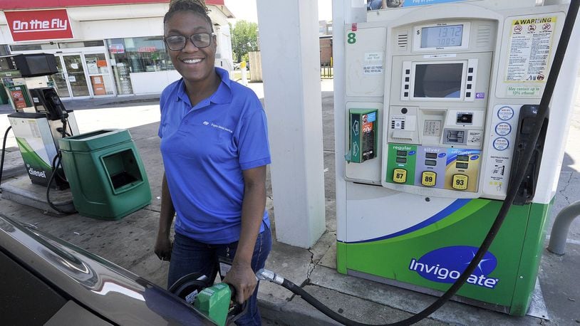 Taylor Vaught fills her gas tank Monday at the BP Station on South Edwin C. Moses Blvd. MARSHALL GORBYSTAFF