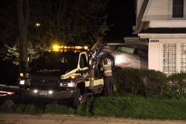 Car goes airborne, crashes into porch of Dayton home