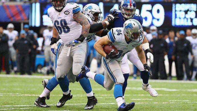 EAST RUTHERFORD, NJ - DECEMBER 18: Zach Zenner #34 of the Detroit Lions carries the ball against the New York Giants in the first half at MetLife Stadium on December 18, 2016 in East Rutherford, New Jersey. (Photo by Al Bello/Getty Images)