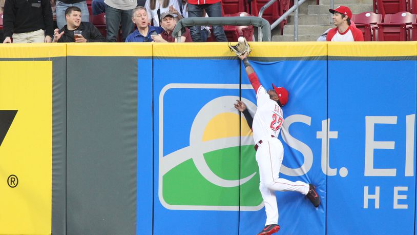 Reds right fielder Phillip Ervin makes a catch against the Cardinals on Thursday, April 12, 2018, at Great American Ball Park in Cincinnati.