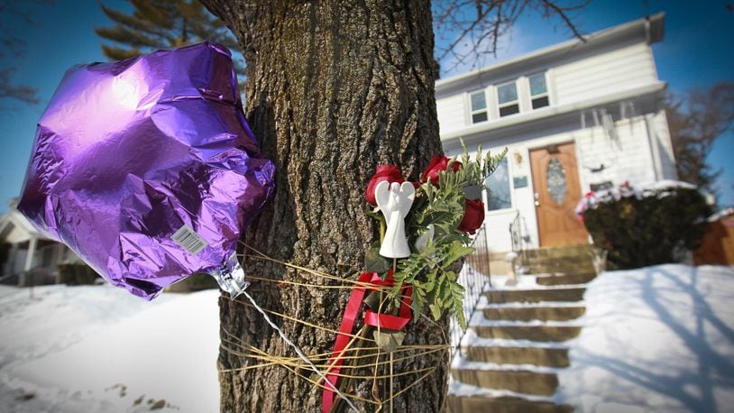 Balloons, flowers and other items were placed in front of Klonda Richey’s home, 31 E. Bruce Avenue in Dayton where she was mauled to death by a neighbor’s pit bull dogs after nine previous complaints filed about the two dogs who fatally attacked her. FILE
