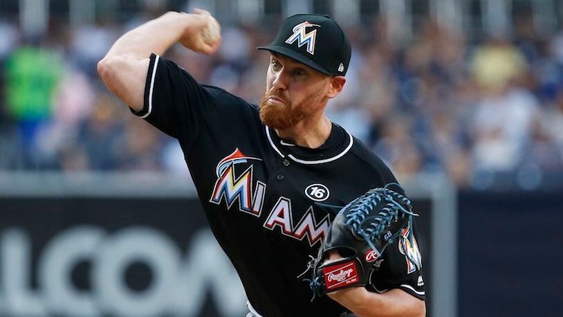 Miami Marlins starting pitcher Dan Straily throws to the plate during the first inning of a baseball game against the San Diego Padres in San Diego, Saturday, April 22, 2017. (AP Photo/Christine Cotter)