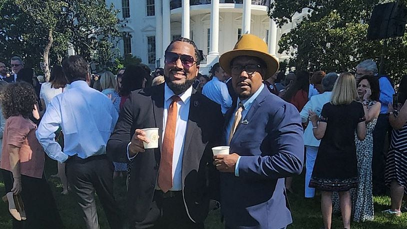Dion Green, right, stands in front of the White House with Gregory Jackson Jr., a fellow survivor of gun violence, Monday, July 11, 2022. The president announced the signing of new bipartisan gun reform legislation. / CONTRIBUTED