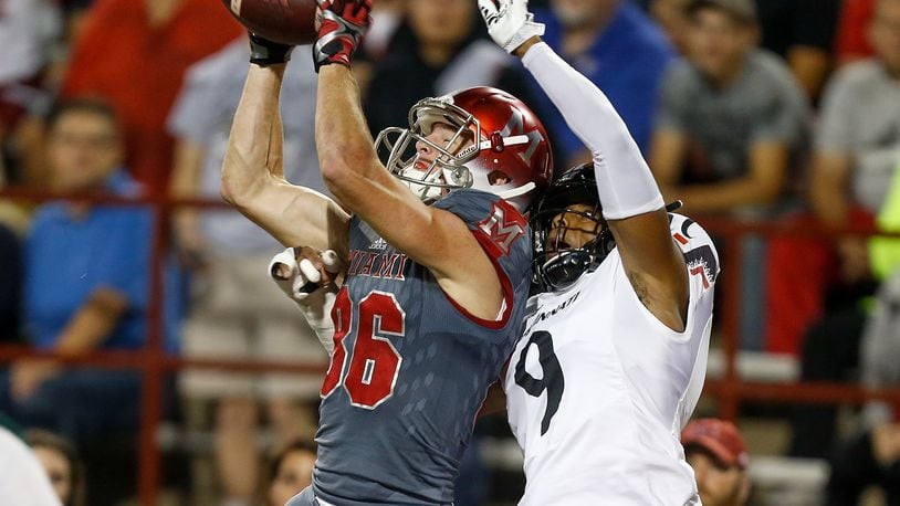 Luke Mayock #86 of the Miami Ohio Redhawks catches a touchdown defended by Linden Stephens #9 of the Cincinnati Bearcats during the first half at Yager Stadium on September 16, 2017 in Oxford, Ohio. (Photo by Michael Reaves/Getty Images)