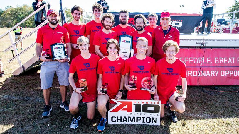 The Dayton cross country team poses with the Atlantic 10 championship trophy on Saturday in Richmond, Va. Submitted photo