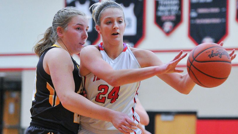 Tecumseh’s Presley Griffitts passes with pressure from Alter’s Emily Long during a nonconference game on Monday night at Reynolds Gymnasium. Bryant Billing/Contributed