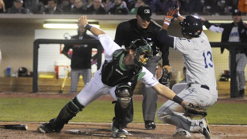 Dragons catcher Tyler Stephenson is too late with the tag on Elvis Rubio. The Dragons defeated the visiting West Michigan Whitecaps (Tigers) 3-2 in a Class A minor-league baseball game at Dayton’s Fifth Third Field on Tuesday, April 11, 2017. MARC PENDLETON / STAFF