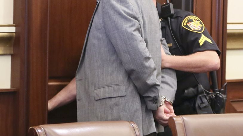 Former Warren County lawmaker Pete Beck is led from the courtroom in handcuffs on Thursday after being sentenced to four years in prison by Hamilton County Common Pleas Judge John Andrew West. The sentence comes two months after Beck was found guilty on 13 0f 38 charges related to his involvement in Christopher Technologies, a failed start-up tech firm.