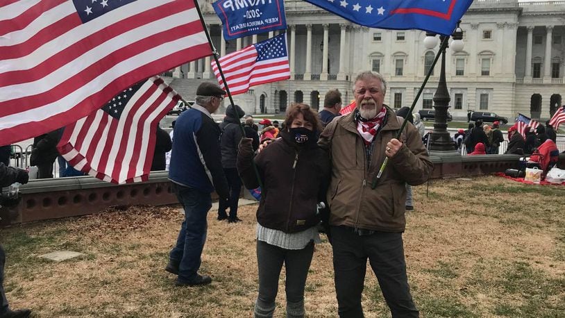 Miamisburg residents Rhonda and Greg Dulin pose for a photo outside the U.S. Capitol in Washington D.C. around 11 a.m. Wednesday, Jan. 6, 2021, before the scene devolved into chaos. Greg Dulin said the actions of those who did so  took things "way too far." CONTRIBUTED