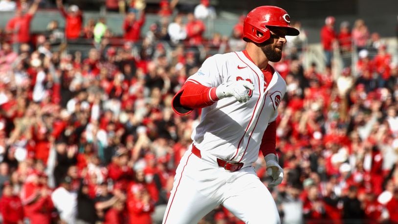 Nick Martini, of the Reds, rounds the bases after hitting a two-run home run in the second inning against the Nationals on Opening Day on Thursday, March 28, 2024, at Great American Ball Park in Cincinnati. David Jablonski/Staff