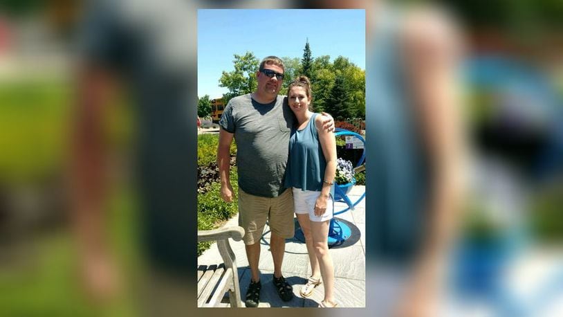 Jason Roberts and his wife, Branden, enjoy a trip to Kings Island. CONTRIBUTED