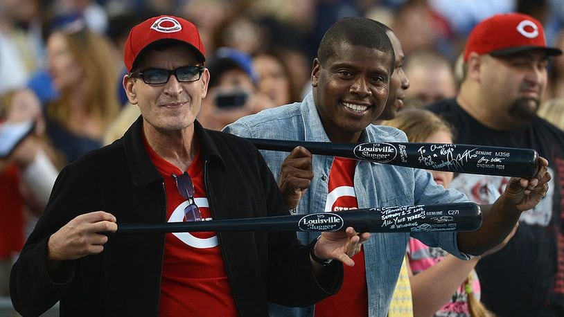 LOS ANGELES, CA - JULY 04: Actor Charlie Sheen and Tony Todd pose with bats during the game between the Cincinnati Reds and the Los Angeles Dodgers at Dodger Stadium on July 4, 2012 in Los Angeles, California. (Photo by Harry How/Getty Images)
