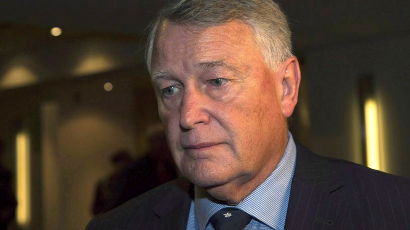 In this Sept. 9, 2016, photo, Federal Court Justice Robin Camp leaves a Canadian Judicial Council inquiry at a hotel in Calgary, Alberta, Canada. Camp, the Canadian judge who asked a woman why she couldn't keep her knees together after she alleged sexual assault in a trial, said in a statement released by his attorney, Thursday, March 9, 2017, that he is resigning from the bench, effective Friday. (Todd Korol/The Canadian Press via AP)