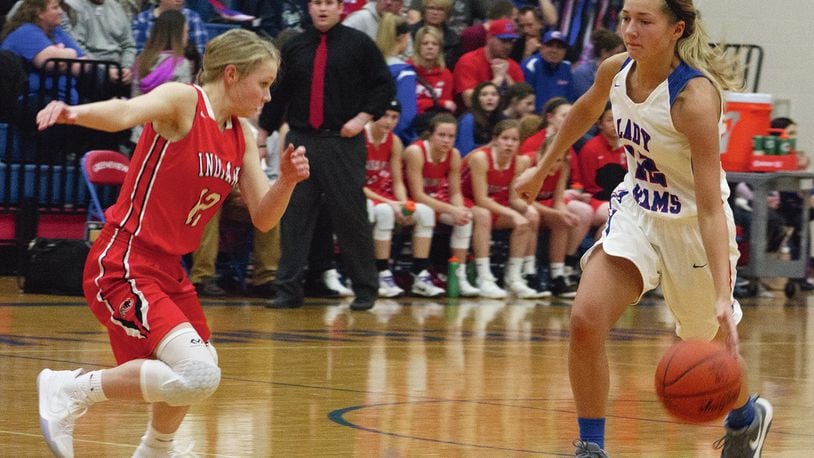 Greeneview senior Frankie Fife dribbles up court against Cedarville’s Sami Buettell. Fife scored 17 points and surpassed 1,000 career points in the Rams’ OHC-clinching 65-36 victory. Jeff Gilbert/CONTRIBUTED