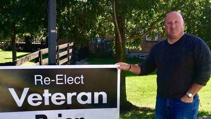 Former Lebanon School Board Member Brian DeGennaro stands in front of the type of sign he was prevented from posting where he and his supporters wanted to during his re-election loss.
