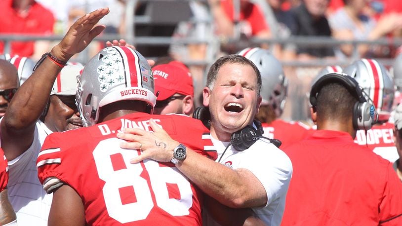Ohio State’s Greg Schiano hugs Dre’Mont Jones after he recorded a safety against UNLV on Saturday, Sept. 23, 2017, at Ohio Stadium in Columbus. David Jablonski/Staff
