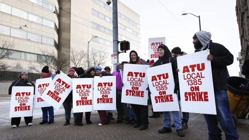 RTA bus drivers and mechanic represented by the Amalgamated Transit Union Local 1385 went on strike at 12:01 a.m. on Monday. About sixty ATU members picketed the Wright Stop Plaza Transit Center on Monday morning. TY GREENLEES / STAFF