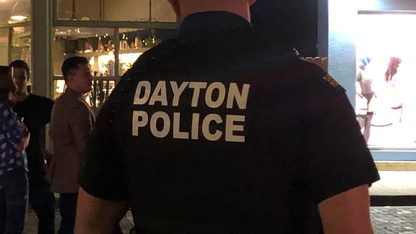 A Dayton police officer in the Oregon District. CORNELIUS FROLIK / STAFF
