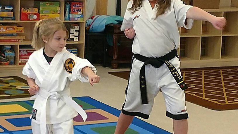Madyson Bruce, right, teaches a taekwondo beginners class at the Youth Center, Wright-Patterson Air Force Base. (Courtesy photo)