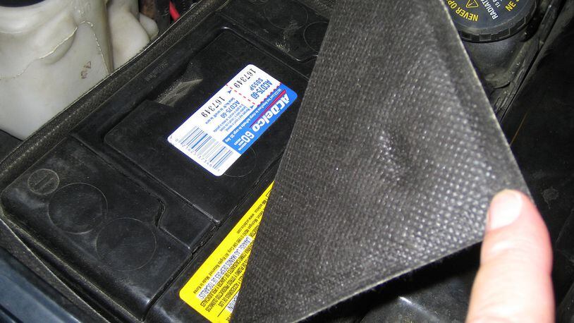 To help protect the battery from engine heat, many vehicle manufacturers use an insulating cover over or around the battery. Heat is hard on any battery. (James Halderman photo)