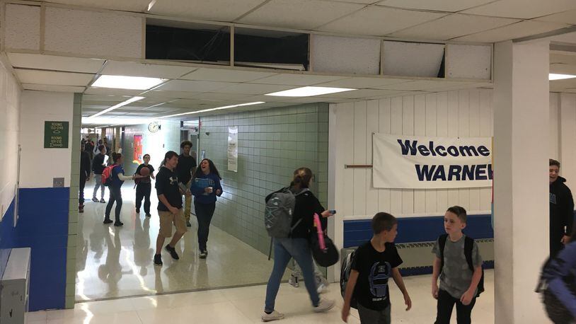 Students at Warner Middle School in Xenia walk past outdated heating vents, nonworking clocks and damaged ceilings Tuesday, Oct. 11, 2016. Xenia Community Schools is asking voters to approve a bond issue Nov. 8 that would pay to replace the district’s middle school and high school. JEREMY P. KELLEY / STAFF