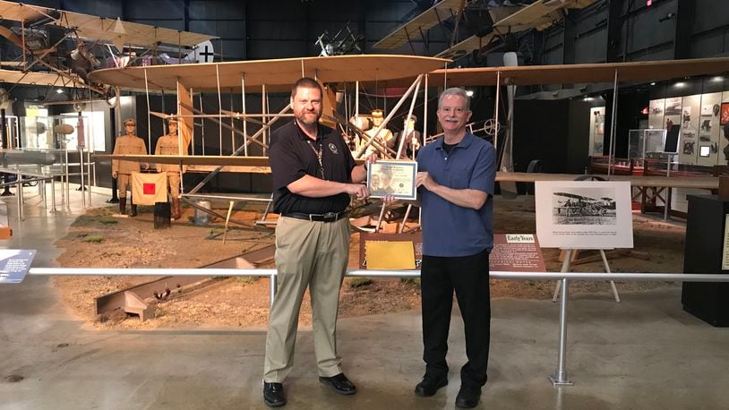 Jack Sprankle (right) received his Master Pilot Award from FAA Safety Team Program Manager Jason Forshey in front of the Wright Brother's 1909 aircraft at the National Museum of the United States Air Force.
