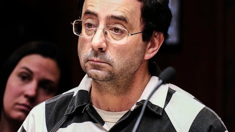FILE - In this Feb. 17, 2017, file photo, Michigan sport doctor Larry Nassar listens to testimony of a witness during a preliminary hearing, in Lansing, Mich. A judge on Friday, April 14, 2017, has barred the public from the courtroom when two women and a teenage girl are expected to testify in June that Nassar sexually assaulted them during medical appointments. (Robert Killips /Lansing State Journal via AP, File)