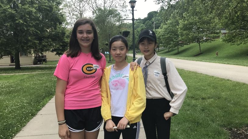 Pictured from left are Sofia Gomez, Huayu Wang and Yanfei Zhang, all middle school students participating in Connect Centerville’s Host Family program with their parents. CONTRIBUTED