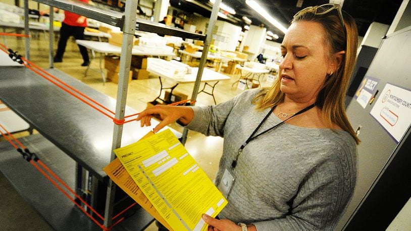 Montgomery County Board of Elections Deputy Director Sarah Greathouse shows an example of a provisional ballot envelope at the board of elections Wednesday, November 9, 2022. Thousands of provisional and absentee ballots may still be counted. MARSHALL GORBY/ STAFF