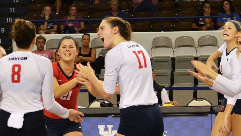 The Dayton volleyball team celebrates a point during a match against the College of Charleston on Sept. 1, 2018, at the Frericks Center in Dayton. Photo by Erik Schelkun