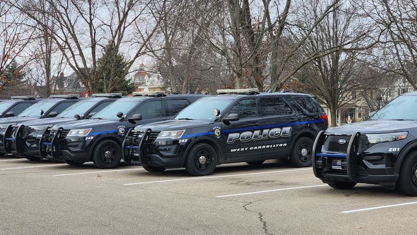 West Carrollton police cruiser sit outside the police department Tuesday, Dec. 13, 2022. The city's police officers and sergeants will receive raises for in 2013, 2014 and 2015. ERIC SCHWARTZBERG/STAFF