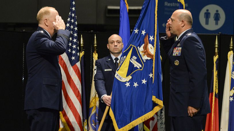 U.S. Air Force Col. Patrick Miller,  right, assumes command of the 88th Air Base Wing from Lt. Gen. Robert McMurry, Air Force Life Cycle Management Center commander, left, during a change of command ceremony Friday.