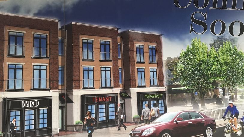 This is a rendering on the side of the buisness at 1916 Brown St. The drawing shows that two vacant buildings on that block could be replaced with a new development. CORNELIUS FROLIK / STAFF