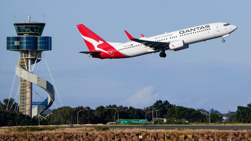 FILE - A Qantas Boeing 737 passenger plane takes off from Sydney Airport, Australia, on Sept. 5, 2022. Qantas Airways agreed to pay 120 million Australian dollars ($79 million) in compensation and fines for selling tickets on thousands of cancelled flights, the airline and Australia’s consumer watchdog said on Monday, May 6, 2024. (AP Photo/Mark Baker, File)