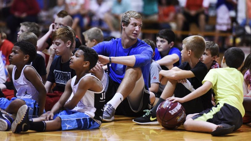 Luke Kennard sits with Air Kev team players during a celebration for the players and parents Friday, June 5, 2015, at Kingdom Sports Center in Franklin. Kennard, basketball trainer Kevin “Air Kev” Duncan, rapper and motivational speaker L.G. Wise and the Kingdom crew spoke to the young basketball players and their families promoting good decisions and work ethics. NICK GRAHAM/STAFF