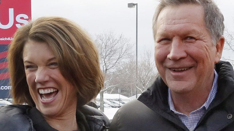 Republican presidential candidate, Ohio Gov. John Kasich and his wife Karen greet supporters at a polling station, Tuesday, Feb. 9, 2016, in Manchester, N.H. (AP Photo/Jim Cole)