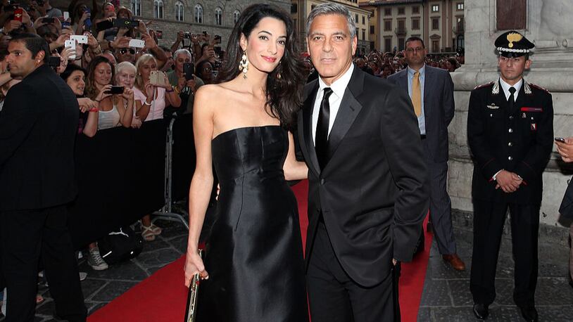 Amal and George Clooney attend the Celebrity Fight Night In Italy Benefitting The Andrea Bocelli Foundation and The Muhammad Ali Parkinson Center Gala on September 7, 2014 in Florence, Italy.  (Photo by Andrew Goodman/Getty Images for Celebrity Fight Night)