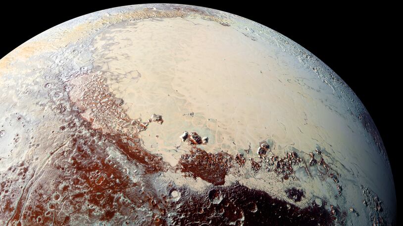 This high-resolution image captured by NASA's New Horizons spacecraft shows the bright expanse of the western lobe of Pluto’s "heart," or Sputnik Planitia, which is rich in nitrogen, carbon monoxide and methane ices. (NASA/JHUAPL/SwRI)