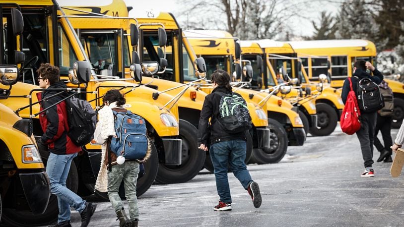 Stebbins High School students load onto the buses Wednesday afternoon Jan. 17, 2024. Mad River schools were on a two-hour delay because of the cold weather. JIM NOELKER/STAFF