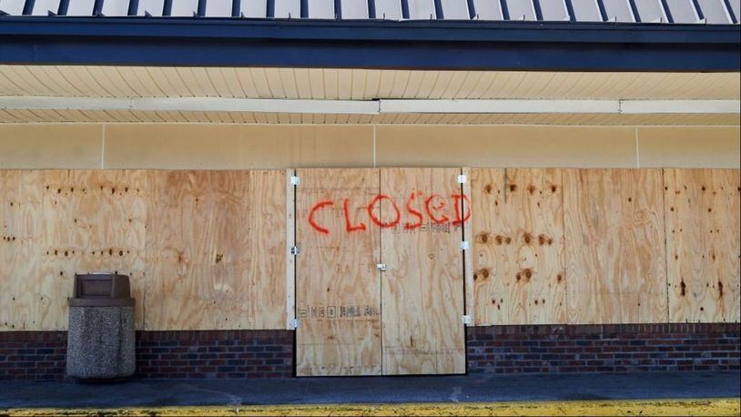 Plywood is seen attached to windows of local businesses as Brevard County has declared a mandatory evacuation for certain zones in preparation for Hurricane Dorian. PHoto: Zack Wittman/Bloomberg via Getty Images