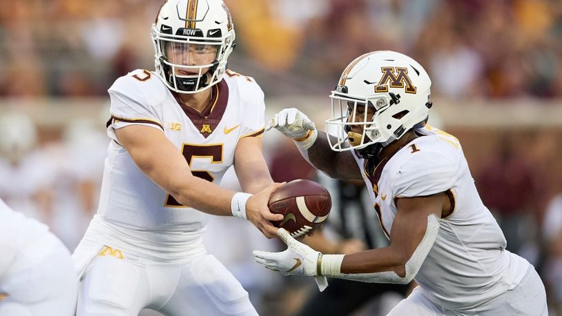 MINNEAPOLIS, MN - AUGUST 30: Zack Annexstad #5 of the Minnesota Golden Gophers hands the ball to teammate Rodney Smith #1 during the game against the New Mexico State Aggies on August 30, 2018 at TCF Bank Stadium in Minneapolis, Minnesota. The Golden Gophers defeated the Aggies 48-10. (Photo by Hannah Foslien/Getty Images)